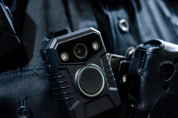 A body camera on a police officers uniform.