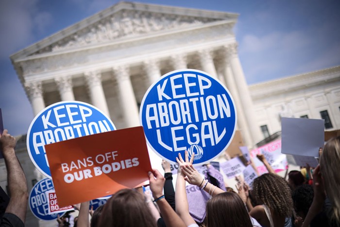 Activists gather at the US Supreme Court Tuesday to protest the courts draft opinion overturning abortion rights.