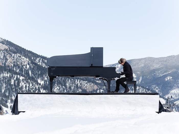 Hunter Noack playing piano in Big Sky Montana