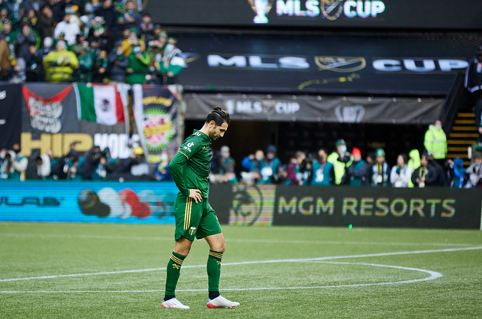 Timbers midfielder Diego Valeri walks back towards the center circle after his penalty kick was saved by New York Citys Sean Johnson.