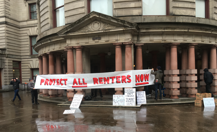 A banner hanging on Portland City Hall in 2018.
